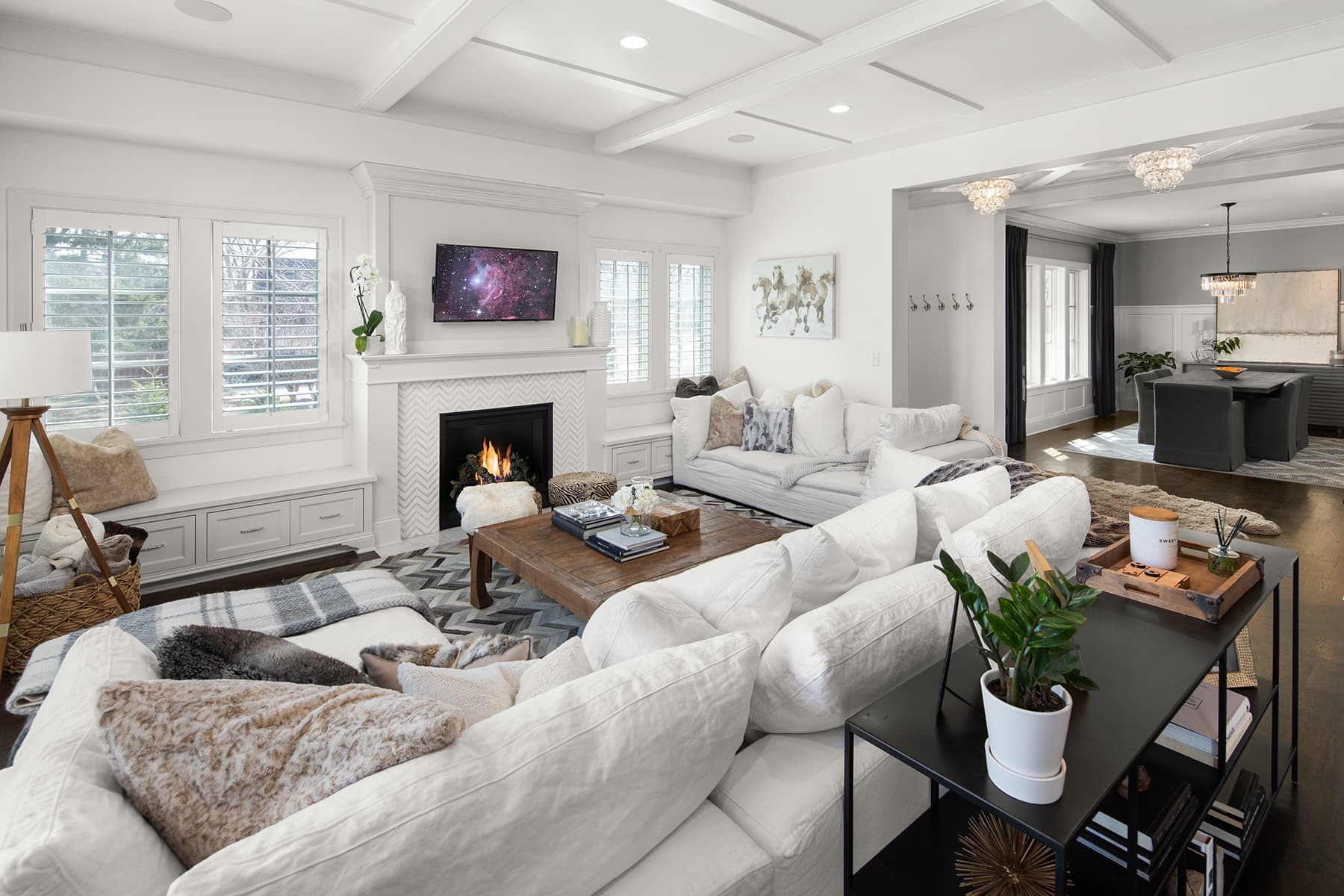 Beautiful Edina home sold by the Berg Larsen Group. White exterior of a family room with dining room in background.